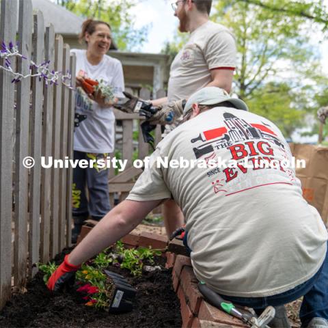 Members of Delta Phi Fraternity interact with homeowner Angel Mendoza as they plant her fairy garden during the Big Event. May 4, 2024. Photo by Kirk Rangel for University Communication.